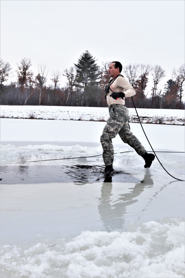 Photo Essay: Soldier takes plunge for cold-water immersion during training at Fort McCoy