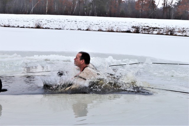 Photo Essay: Soldier takes plunge for cold-water immersion during training at Fort McCoy