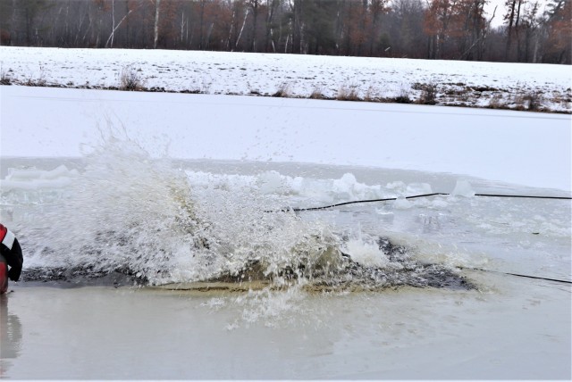 Photo Essay: Soldier takes plunge for cold-water immersion during training at Fort McCoy
