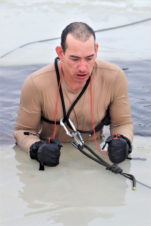 Photo Essay: Soldier takes plunge for cold-water immersion during training at Fort McCoy