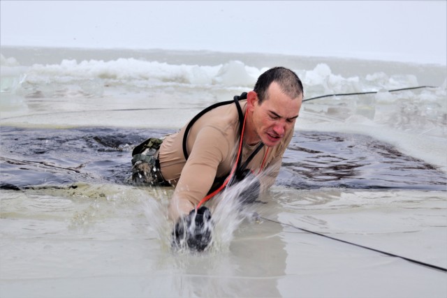 Photo Essay: Soldier takes plunge for cold-water immersion during training at Fort McCoy