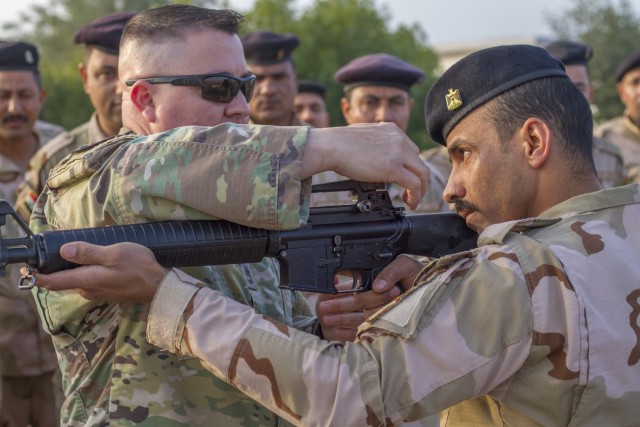 Soldiers provide marksmanship tips in Iraq