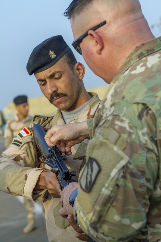 Soldiers provide marksmanship tips in Iraq