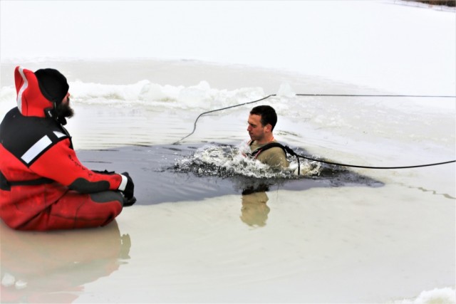 Students take icy plunge for cold-weather operations training at Fort McCoy