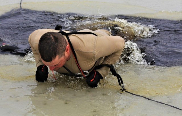Students take icy plunge for cold-weather operations training at Fort McCoy