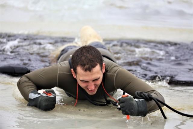 Students take icy plunge for cold-weather operations training at Fort McCoy