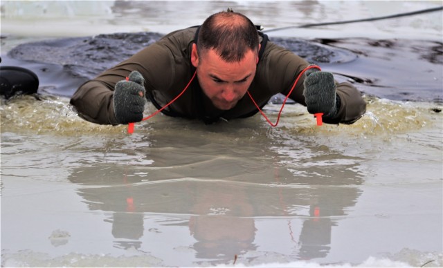Students participate in cold-water immersion training for CWOC Class 19-01 at Fort McCoy