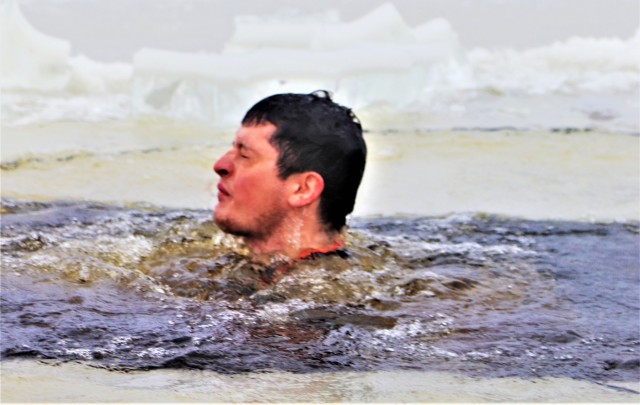 Students participate in cold-water immersion training for CWOC Class 19-01 at Fort McCoy