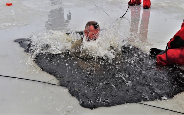 Students participate in cold-water immersion training for CWOC Class 19-01 at Fort McCoy