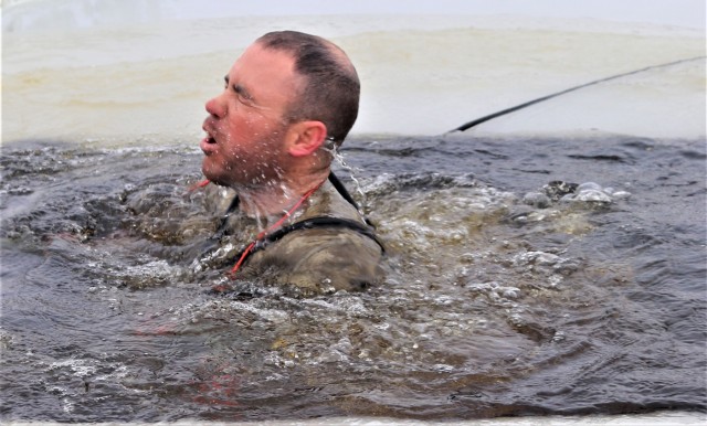 Students participate in cold-water immersion training for CWOC Class 19-01 at Fort McCoy