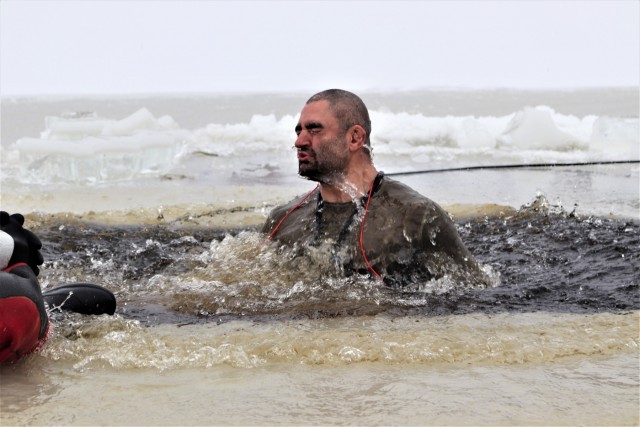 Students participate in cold-water immersion training for CWOC Class 19-01 at Fort McCoy