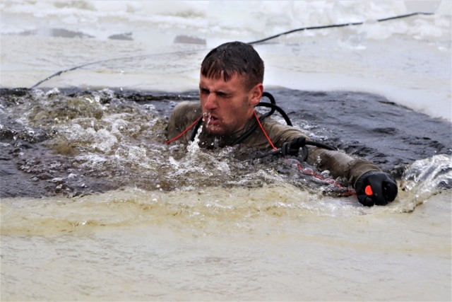 Students participate in cold-water immersion training for CWOC Class 19-01 at Fort McCoy