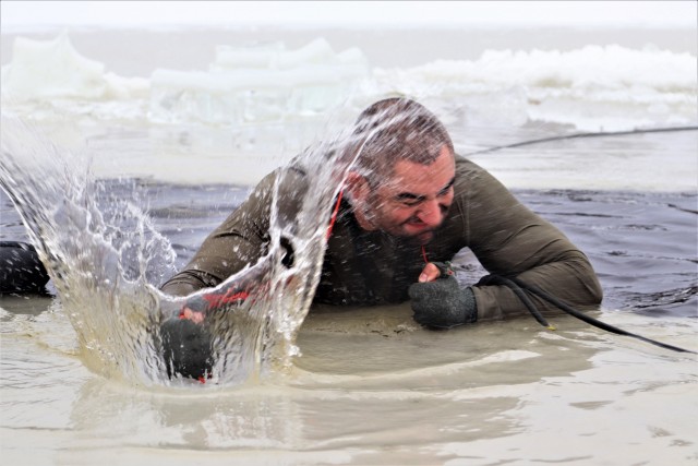 Students participate in cold-water immersion training for CWOC Class 19-01 at Fort McCoy