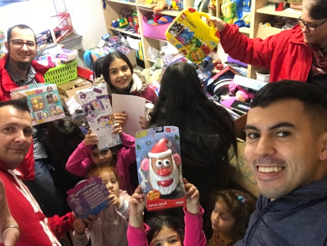 Devil dogs with halos deliver toys to children