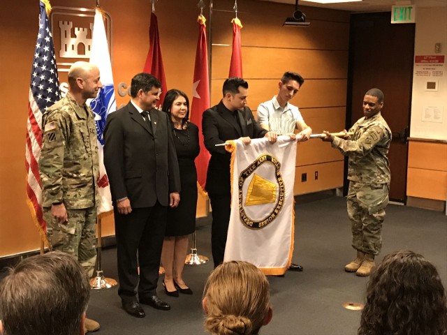 Corps inducts SES employee
