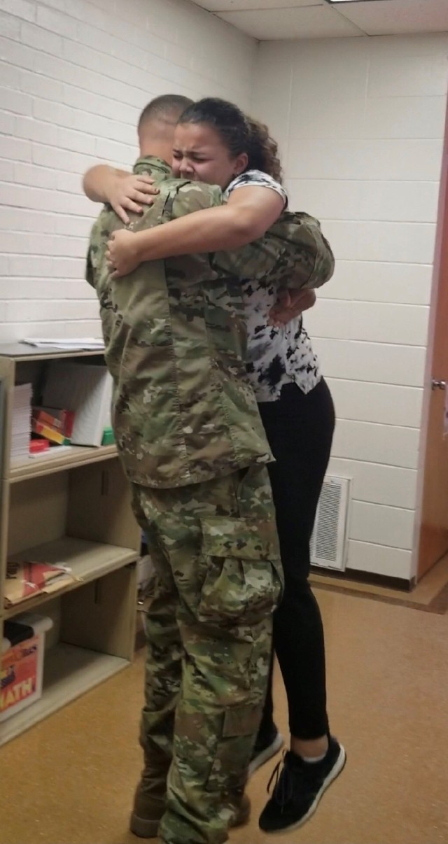 Soldier makes surprise reunion with daughters after returning from deployment