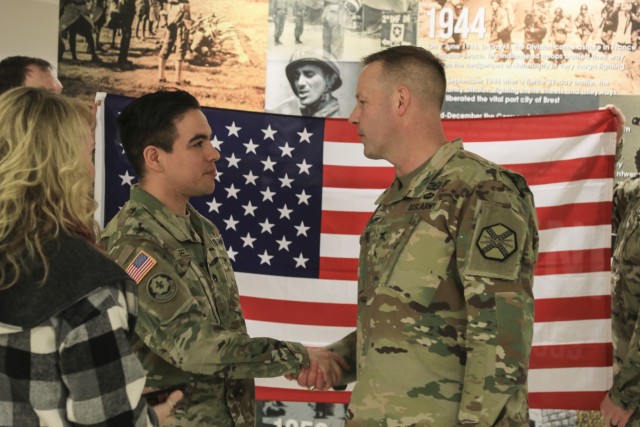 Reenlistment unites two generations of Army