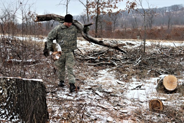 Cold-Weather Operations Course students build improvised shelters, survive outdoors