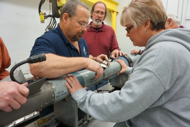 LEMC technicians replace the forward hanger during AIM-9X hands-on training provided by Raytheon Missile Systems, Tucson, Arizona at Letterkenny Munitions Center.  