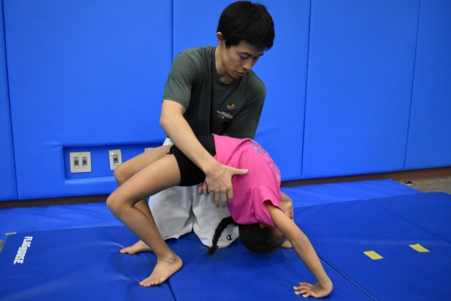 Camp Zama youth gymnastics class balances fun, challenge