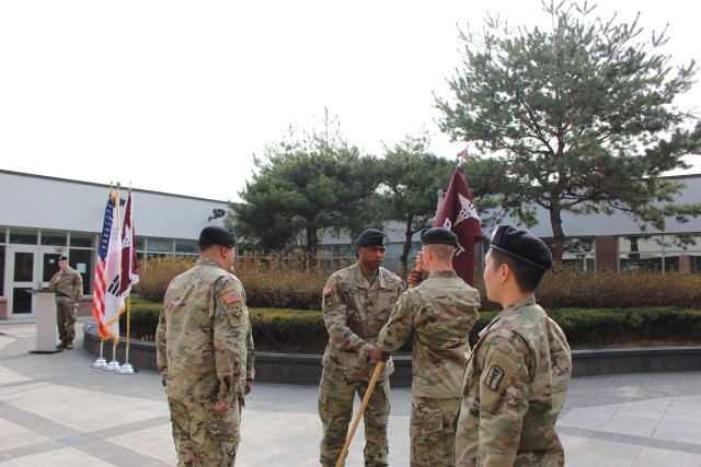 Sgt. 1st Class Pritchett passes the guidon