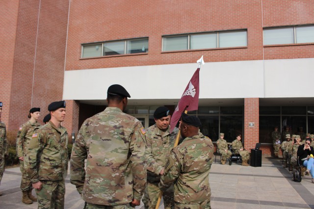 Sgt. 1st Class Rosner pass the guidon to Maj. Sama