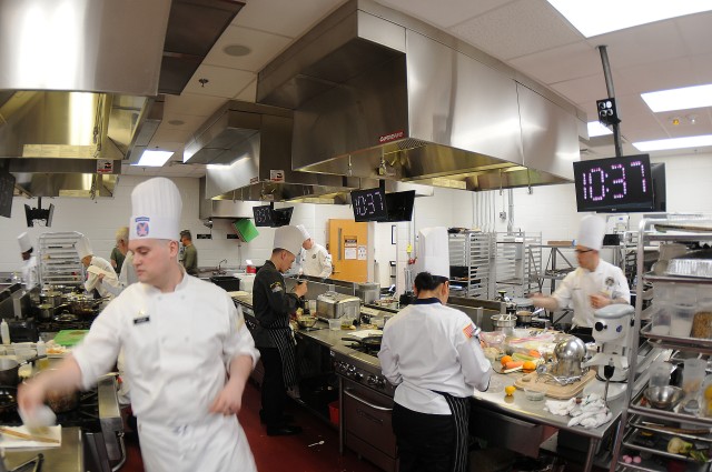 Top chefs work to complete dishes