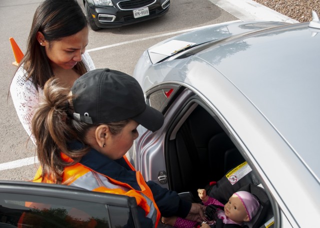Fair demonstrates, educates proper car seat safety