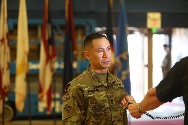 Sgt. Maj. Delfin J. Romani, 1st Stryker Brigade Combat Team, 4th Infantry Division conducts an interview with Channel 11 news after the change of responsibility ceremony