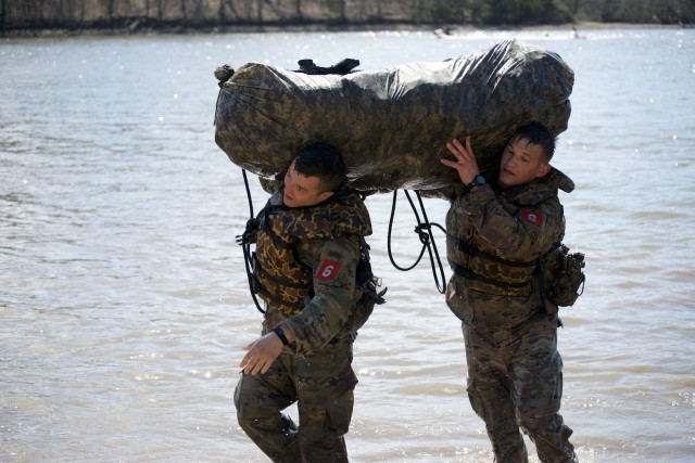 1st Lt. Jeremy Y. Matsumoto and Capt. Erwin J. Marciniak from 299th Brigade Engineer Battalion, 1st Stryker Brigade Combat Team, 4th Infantry Division, conduct water borne operations.