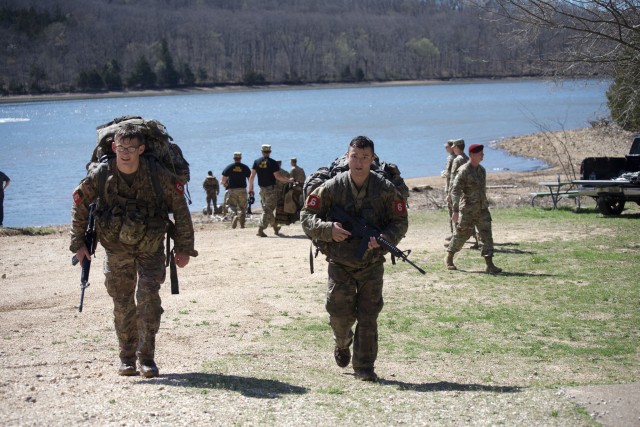1LT Jeremy Y. Matsumoto and Capt. Erwin J. Marciniak from 299 th Brigade Engineer Battalion, 1st Stryker Brigade Combat Team, 4th Infantry Division step off for their road march after completing the w