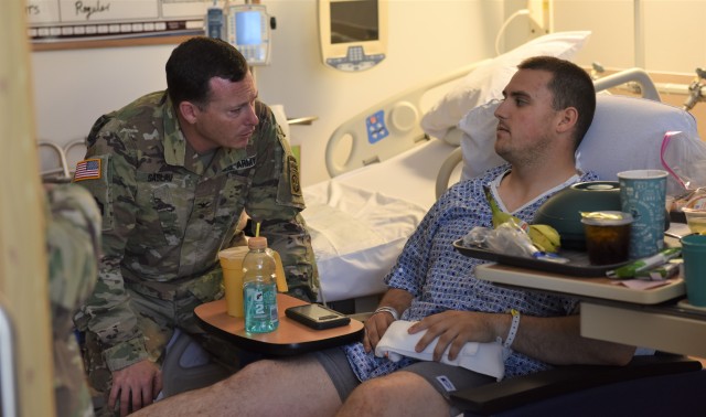 Col. Saslav visits his injured paratrooper at WAMC
