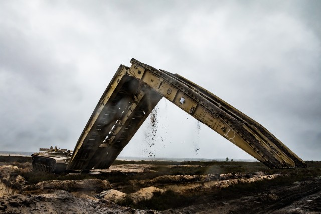 1st Engineer Soldiers Moving Across Bridges