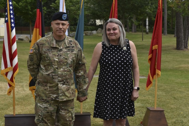 Brig. Gen. Christopher LaNeve holds wife, Kimberly's hand