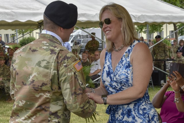 Kathryn Norrie receives flowers at 7th ATC's Change of Command ceremony