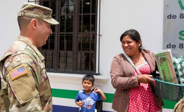 Soldiers visit local city to share information about a free medical event during annual training exercise