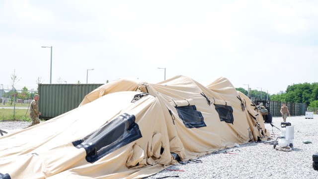 Air-supported TEMPER tent being set up at the medical support compound