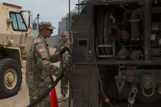 Iowa Army National Guard convoy fuels up at local co-op