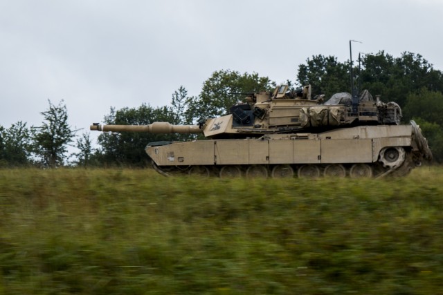 M1A2 Abram tank Troops drive down the road during a Combined Resolve training exercise in Grafenwoehr Training Area, August, 8, 2019.