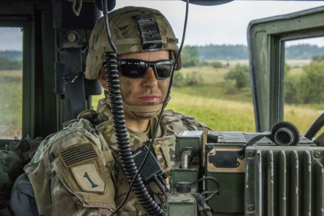 Sfc. Aaron Marcus, an Observer Controller Trainer (OCT) assigned to the Joint Multinational Readiness Center (JMRC) monitors communications during a Combined Resolve training exercise in Grafenwoehr T