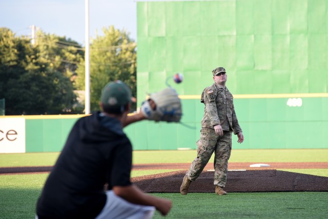 Soldier receives honor throwing in a first pitch at Joliet Slammers home game