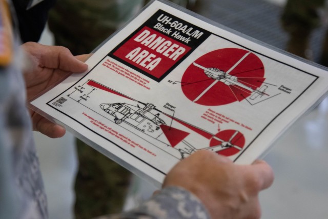 Army firefighters review UH-60 Black Hawk safety information