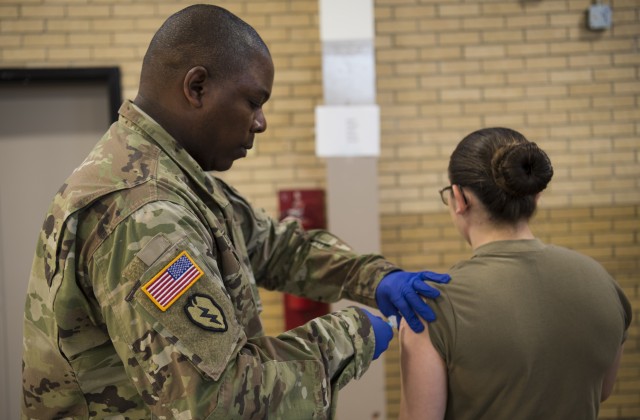 A Soldier receiving a vaccine.