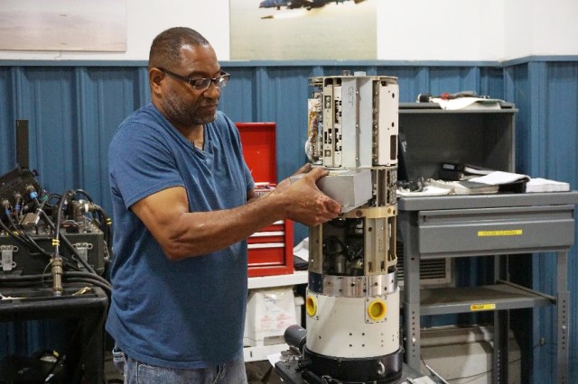 High-Speed Anti-Radiation Missile (HARM) technician works on a HARM