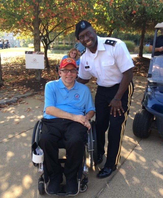 The Surgeon General salutes paralyzed veterans at golf tournament