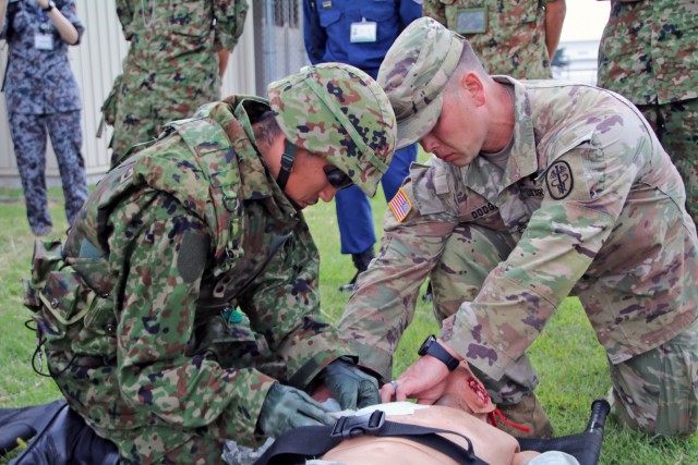 Japan, U.S. Medics tackle realistic combat casualty care