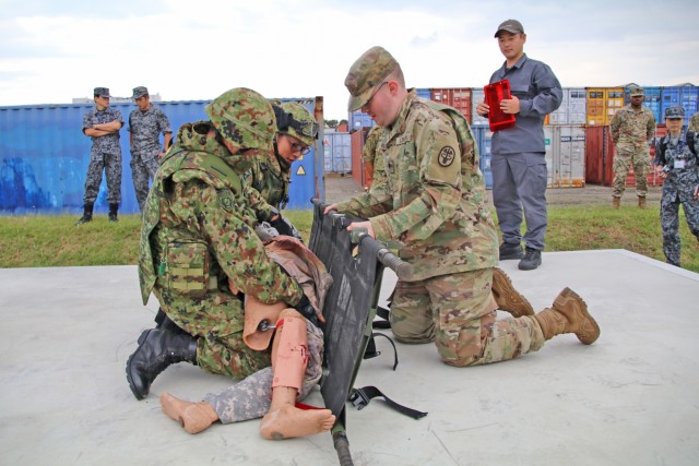 Japan, U.S. Medics tackle realistic combat casualty care