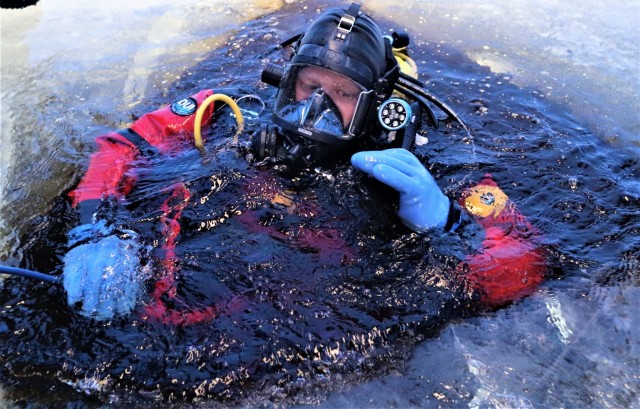 Fort McCoy firefighters practice diving under ice for rescue operations