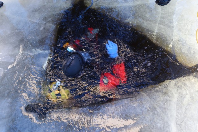 Fort McCoy firefighters practice diving under ice for rescue operations