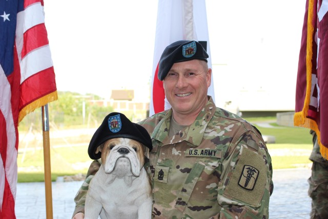 1st. Sgt. Dilday holds the unit's mascot
